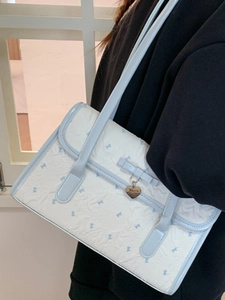 White pleated shoulder bag with blue bow prints and heart pendant for women