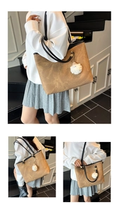 Detail view of vintage brown tote bag featuring matte leather texture and cute sheep charm