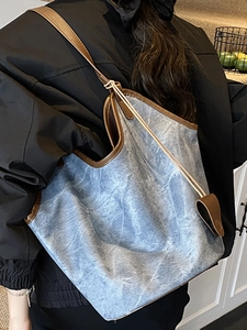 Vintage light blue denim tote bag with brown leather trim for office and casual style