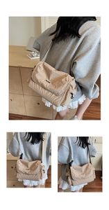 Detailed view of beige pleated nylon messenger bag with side zipper and flap closure
