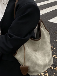 Large gray suede bucket tote bag with brown leather trim for women, urban street style