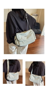 Detailed views of mint green nylon messenger bag showing side zippers and adjustable strap