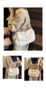 Detail of off-white wrinkled nylon tote bag with black logo and wide shoulder strap