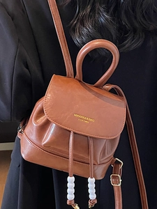 Vintage brown PU leather mini backpack with gold lettering and drawstring closure for women