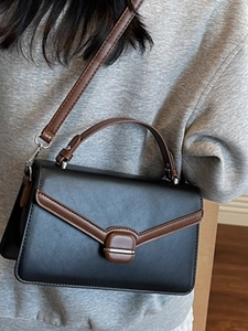 Women's minimalist commuter crossbody bag with large capacity and buckle closure
