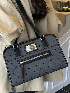 Chic grey polka dot tote bag with black handles, minimalist retro commuter style
