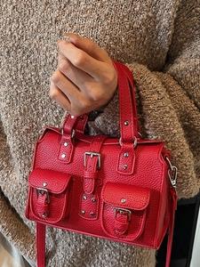 Fashionable red lychee textured handbag with silver buckles and double front pockets