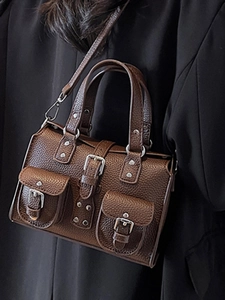 Brown litchi grain leather handbag with front pockets and silver hardware for women