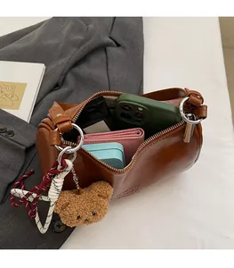 Detailed view of the spacious interior of this brown leather vintage barrel bag