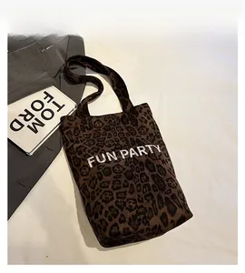 Detailed macro view of the leopard print plush tote bag with FUN PARTY letter print
