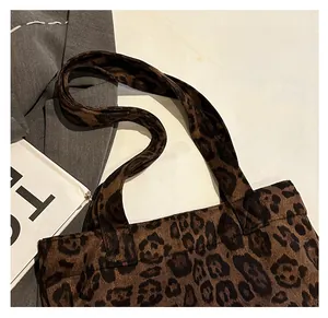 Detailed view of the leopard print tote bag featuring a comfortable wide shoulder strap