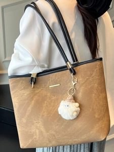 Brown large capacity tote bag for women with plush pendant for school and daily commute