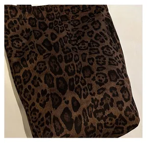 Detailed view of the leopard print plush fabric and texture on this autumn tote bag