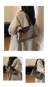 Detailed view of brown quilted suede shoulder bag with decorative wooden bead strap and tassel