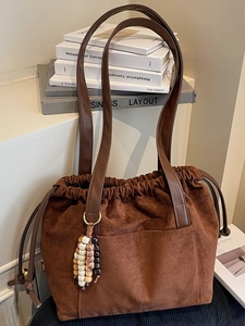 Brown suede drawstring tote bag with large capacity and vintage beaded charm for women