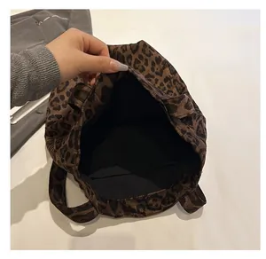 Interior view of leopard print tote bag showing black lining and large capacity storage
