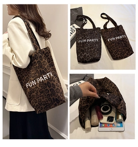 Macro view of leopard print tote bag with Fun Party embroidery and large storage space