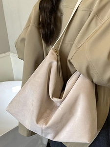 Minimalist beige hobo shoulder bag in soft matte PU leather with spacious interior