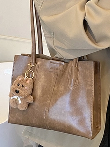 Vintage brown PU leather tote bag with plush bear charm and spacious shoulder strap