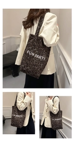 Detailed texture of leopard print tote bag featuring the white FUN PARTY graphic print