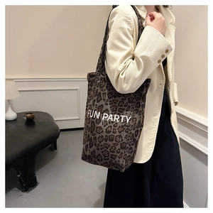 Close-up of leopard print tote bag fabric with Fun Party white letter printing