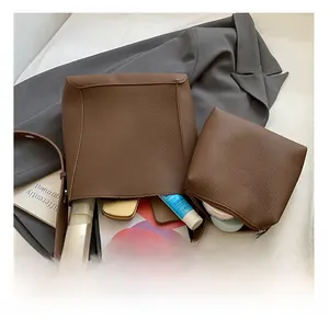 Top view of large brown lychee leather bucket bag showing spacious interior storage