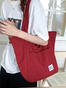 Minimalist red nylon tote bag for women featuring Berry Bread patch and large capacity