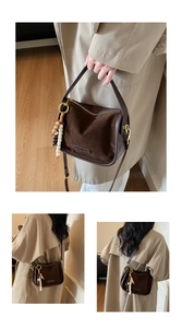 Detail of leopard print vintage crossbody bag with wooden beads and suede texture
