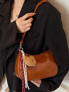 Retro brown PU leather underarm bag with cute bear charm and striped tassel accessories