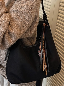 Retro black suede hobo bag with bohemian tassels and leather strap for women