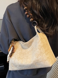 Quilted beige shoulder bag with large capacity and stylish wooden bead strap for commuting