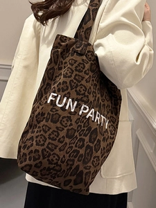 Chic leopard print plush tote bag with Fun Party text for stylish autumn commute