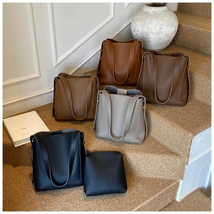 Detailed view of large capacity faux leather tote bag sets with pebble grain texture