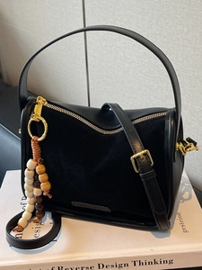 Fashionable leopard style black tote bag with gold zippers and decorative beads