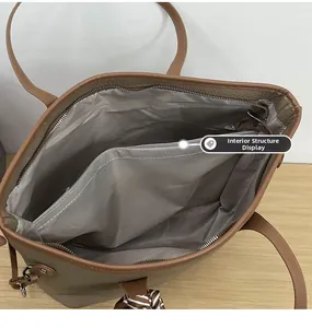Macro view of beige leather tote bag interior with gray lining and zipper compartment