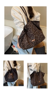 Detail of the leopard print canvas tote bag with 'our fave' leather patch on the side