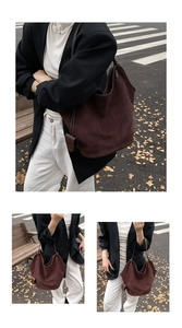 Close-up of vintage brown suede tote bag with matching pendant accessory for women