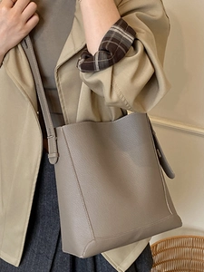 Chic taupe pebbled leather bucket bag for women with large capacity shoulder strap