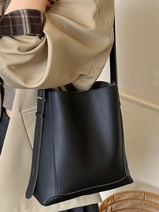 Classic black pebbled leather bucket bag for women with adjustable shoulder strap