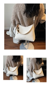 Detail of white crescent leather tote bag with retro wooden beads and slim shoulder strap