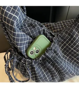 Detail view of the durable inner pocket holding a smartphone in a navy checkered bag