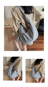 Close-up of grey plaid crossbody bag showing drawstring details and fabric texture