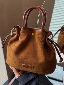 Retro brown suede bucket bag with top handle and drawstring closure for women