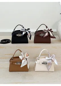 Litchi pattern leather handbags in four colors with decorative silk scarves on handles
