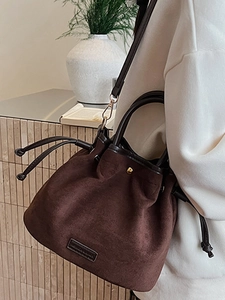 Retro dark brown suede drawstring bucket bag with slim handle and shoulder strap