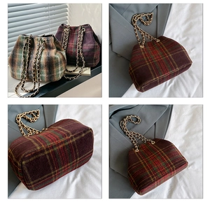 Detailed close-up of wool plaid bucket bag with gold chain strap in red and green colors
