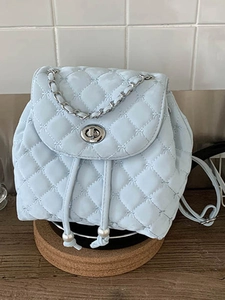 Chic light blue quilted backpack with embroidery and elegant silver chain handle for women