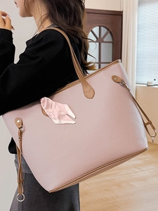 Pink lychee grain leather tote bag with brown trim and fashion scarf accessory