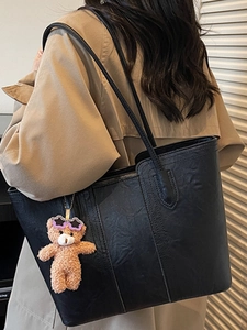 Retro black large capacity tote bag in distressed leather with a cute bear charm accessory