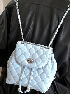 Quilted light blue leather backpack with silver metal turn-lock and pearl drawstrings